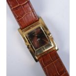 A gents gilt metal Pivot quartz wristwatch, with reversible watch head. On original strap.