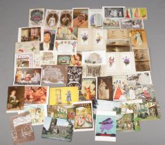 A collection of vintage postcards and Christmas cards. Includes advertising, commemorative,