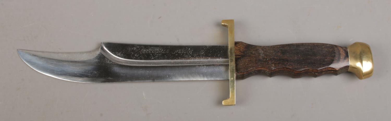 A 'Crocodile Hunter' bowie knife in sheath, with sharpening stone. Blade length 8.25 inches. - Image 2 of 2