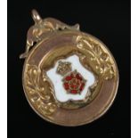 A 9ct gold fob with enamel Lancashire Rose crest inscribed for Holbrook & Dist F.L Junior Winners