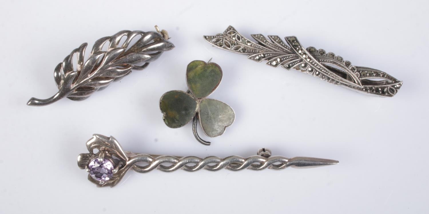 Four silver brooches to include thistle with twisted stem and Victorian Joseph Cook shamrock (