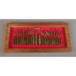 A cased ammunition display featuring varying types and calibers to include .500, 300 Magnum,