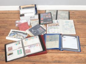 A box of assorted stamps and first day covers of mainly unfranked Queen Elizabeth II examples from