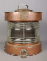 A Meteorite copper and glass ships masthead lantern, with the glass etched M.W. S.L.C 120. Has