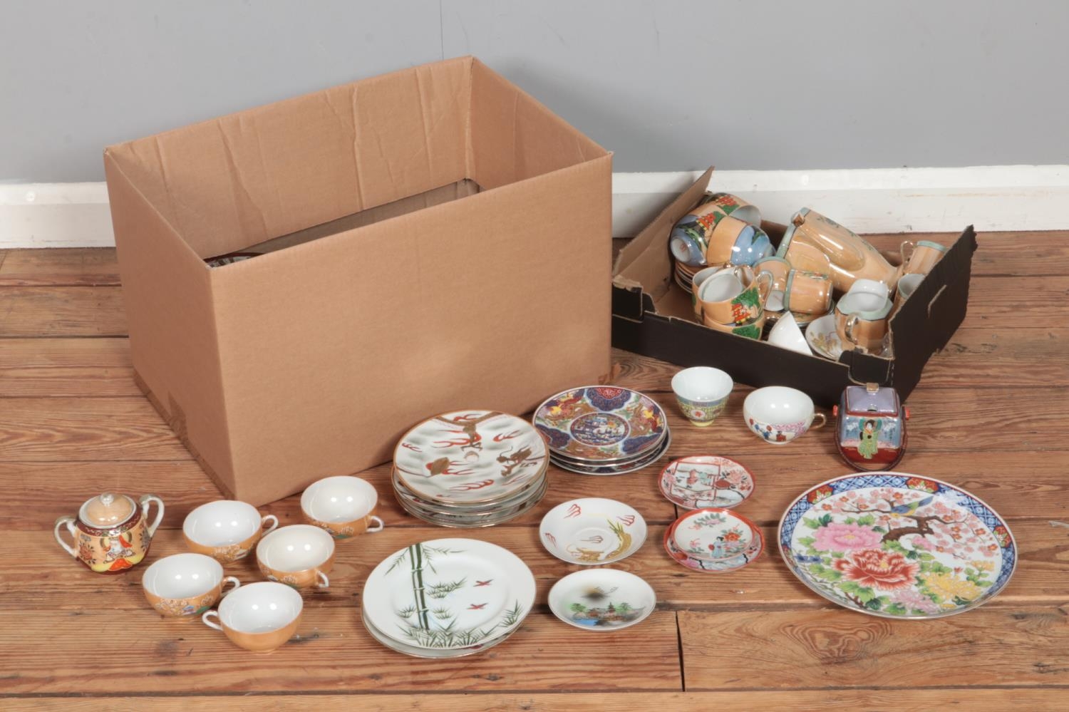 Two boxes of oriental ceramics to include tea wares, plates, etc.