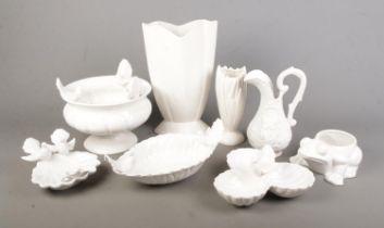 A collection of white ceramics including several white bird decorated dishes and bowls.