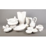 A collection of white ceramics including several white bird decorated dishes and bowls.