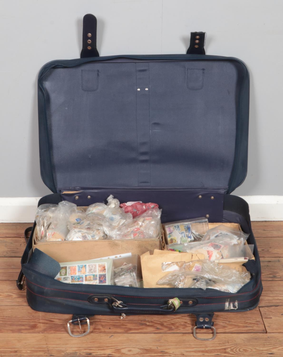 A suitcase containing a large collection of used stamps, covers and postcards, including Great
