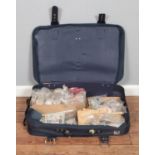 A suitcase containing a large collection of used stamps, covers and postcards, including Great