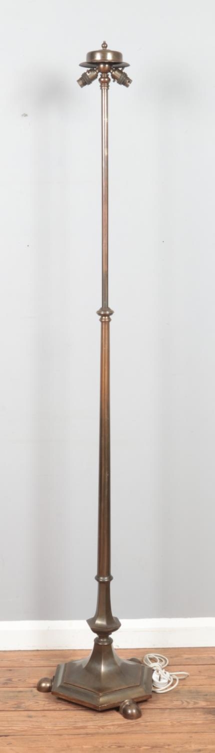 A bronze 'Rise and Fall' standard lamp, on hexagonal base, raised on three ball feet. Maximum - Image 2 of 2