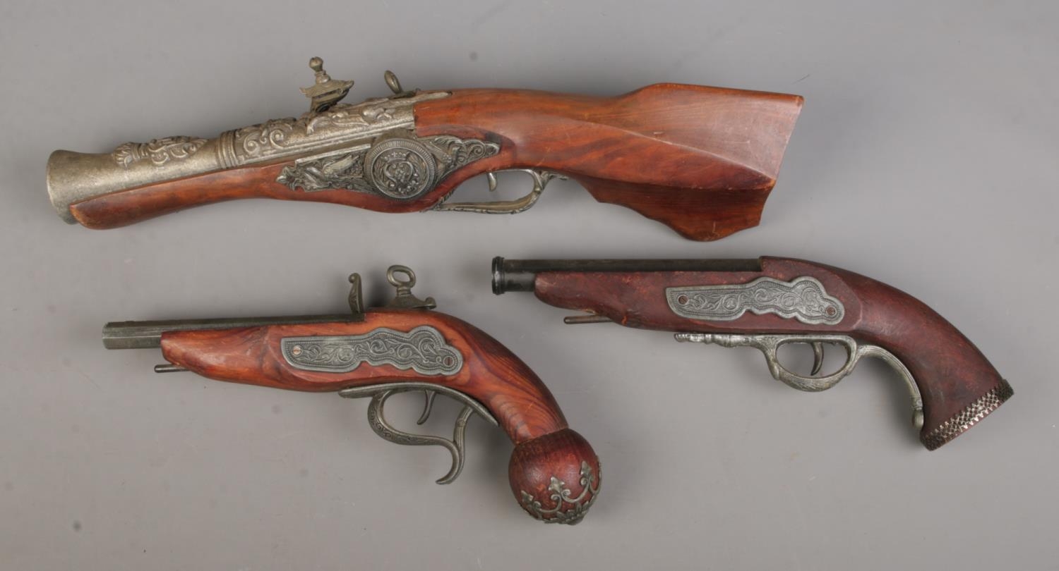 Three replica Blunderbuss pistols, largest 48cm long.