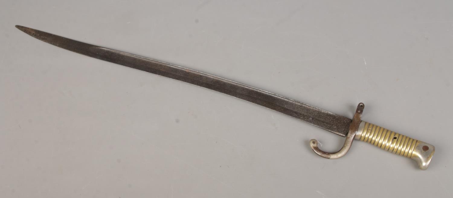 An 1866 pattern French Chassepot sword bayonet, together with a Tommie/Brodie helmet with chin - Image 2 of 3