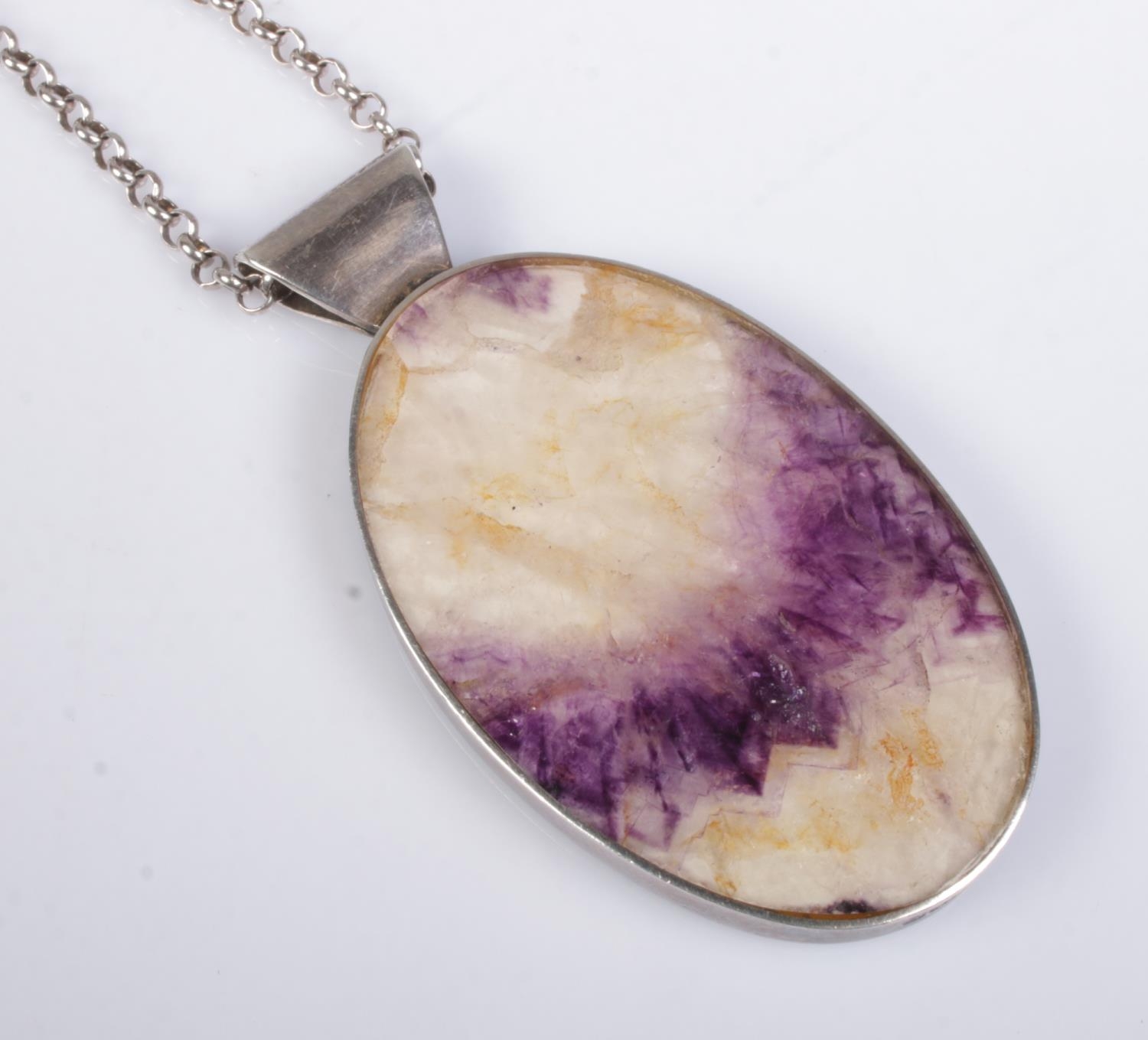 A large silver mounted blue john pendant, on white metal belcher chain. Pendant mount assayed for