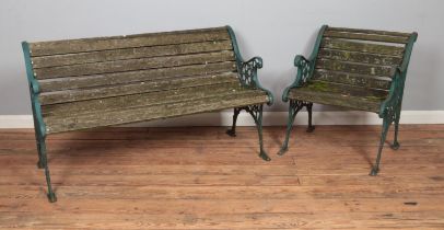 A cast iron garden bench and chair, with slatted seat and back. Both pieces require new slats.