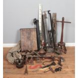A large qauntity of metalwares mostly tools and other cast iron pieces including clamps, iron,