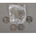 Nine 2002 Golden Jubilee commemorative Â£5 coins. Includes five in sealed packaging.