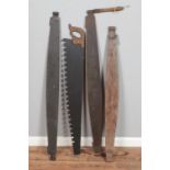 A collection of vintage saws mostly two man examples.
