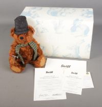 A boxed limited edition Steiff mohair teddy bear titled Teddy Bear Christmas Caroler with top hat