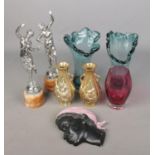 A collection of miscellaneous figures and glassware to include pair of white metal figures raised on