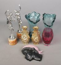 A collection of miscellaneous figures and glassware to include pair of white metal figures raised on