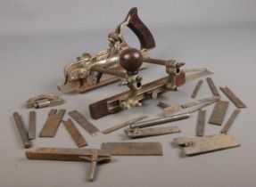 A Stanley No.45 plane with collection of blades.