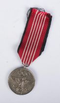 A WWII Third Reich 1936 Berlin Olympics civil decoration medal featuring German Eagle and Olympic