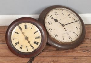 A Smith's wall clock with broad arrow mark, 1955, together with similar postman's alarm style clock.