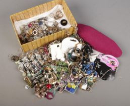 A box of modern costume jewellery. Includes shell necklace, pendants, brooches, rings etc.