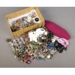 A box of modern costume jewellery. Includes shell necklace, pendants, brooches, rings etc.