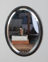 An oval framed bevel edge L.N.E.R. mirror. Height: 42cm, Width: 32cm.