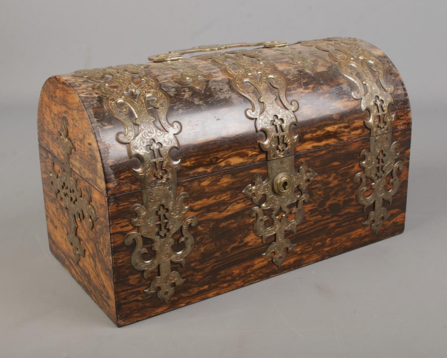 A Victorian brass bound coromandel domed top tea caddy. The lock stamped for S Mordan & Co. Having