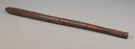 A carved hardwood tribal club, possibly Aboriginal. With chequered and banded design and tapered