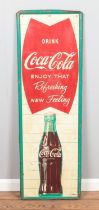 A vintage mid to late 20th Century American shop display advertising tin sign for Coca Cola "Enjoy