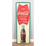 A vintage mid to late 20th Century American shop display advertising tin sign for Coca Cola "Enjoy