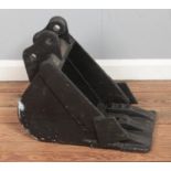 A cast iron mini digger bucket. Standing height 45cm approx