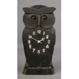 A novelty carved owl Black Forest mantle clock with rocking eyes, 24cm tall.