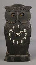 A novelty carved owl Black Forest mantle clock with rocking eyes, 24cm tall.