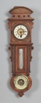 A Victorian walnut cased wall clock, thermometer and barometer, with white enamel dial set with