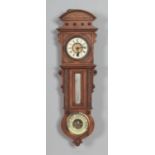 A Victorian walnut cased wall clock, thermometer and barometer, with white enamel dial set with