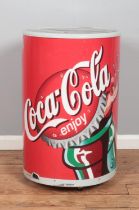 A retro Coca-Cola can-shaped fridge.