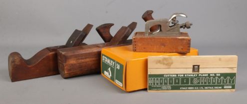 Four vintage planes, to include boxed and unused Stanley No. 50 and Record No. 077A in wooden box.