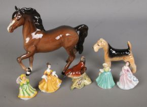 A collection of ceramic figures to include Beswick prancing horse, Airedale Terrier and Wren along