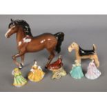 A collection of ceramic figures to include Beswick prancing horse, Airedale Terrier and Wren along