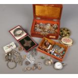 A vintage jewellery box with contents of vintage jewellery. Includes silver watch case, E Atkins