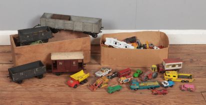 Two boxes of vintage model vehicles, to include wooden railway carriages and a selection of