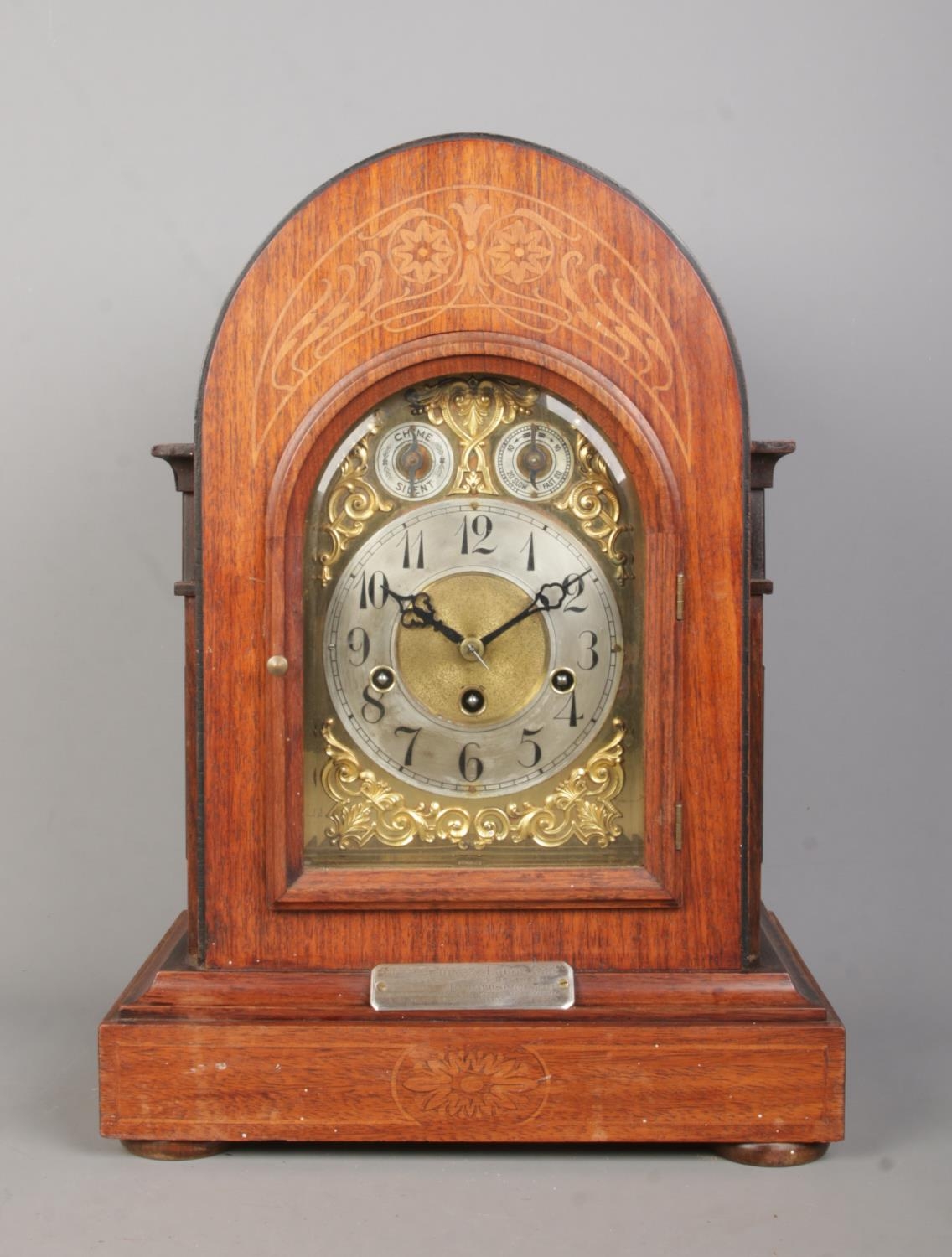 A Junghans inlaid mahogany bracket clock. Having brass dial and subsidiary dials for speed and