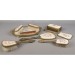 A collection of dressing table sets, to include hand brushes and mirrors, comb and stand. Features