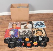 A box of assorted vinyl LP records and singles of mainly pop and rock to include Michael Jackson