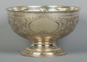 A George V silver punch bowl with embossed decoration. Assayed Sheffield 1928 by John & William F