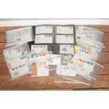 A large collection of Royal Mail First Day Covers, loose and in albums. To include Christmas,